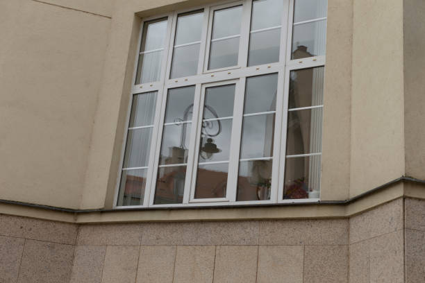 istock A large window on a building with a bell hanging from it 2183721388
