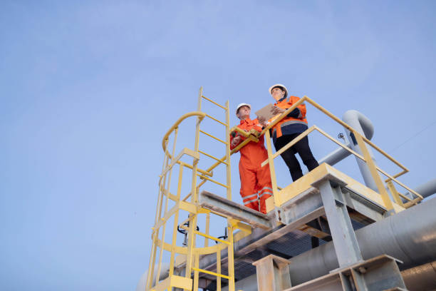 istock Group of petroleum engineers having a discussion at the site 2183721876