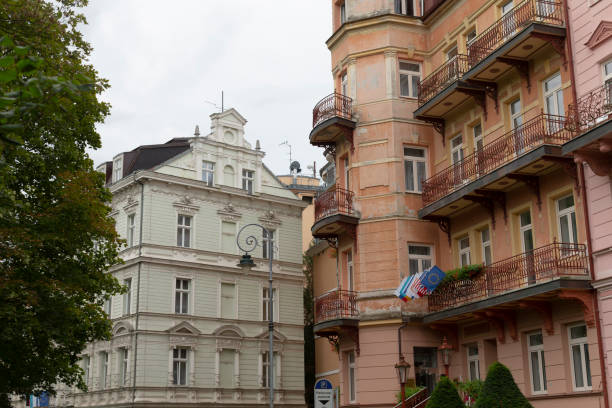 istock A row of buildings with attractive balconies and lush trees 2183723921