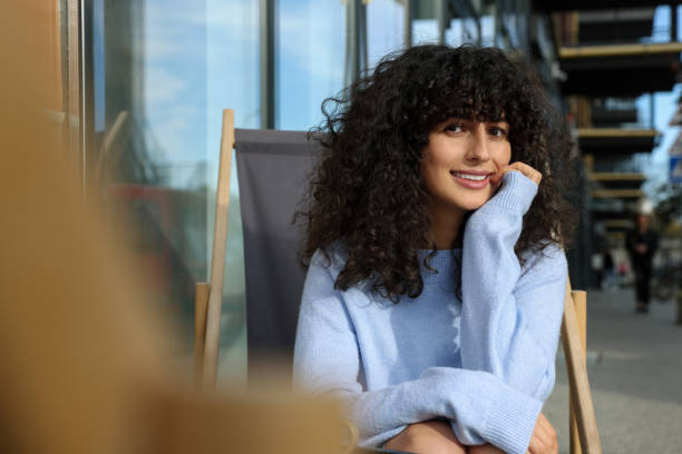 istock Happy young woman in stylish light blue sweater outdoors. Space for text 2183726788