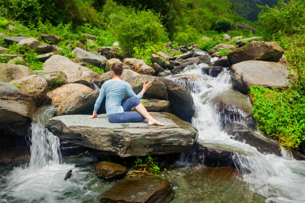 istock Woman doing Ardha matsyendrasanaasana asana outdoors 2183729162