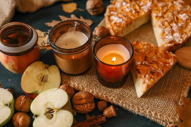 istock Two burning candles in an autumn atmosphere, cozy mood 2183730912