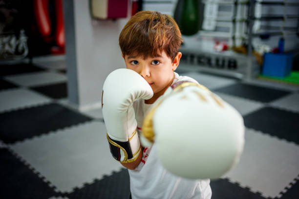 istock child athlete practicing shadow boxing in a gym 2183731143