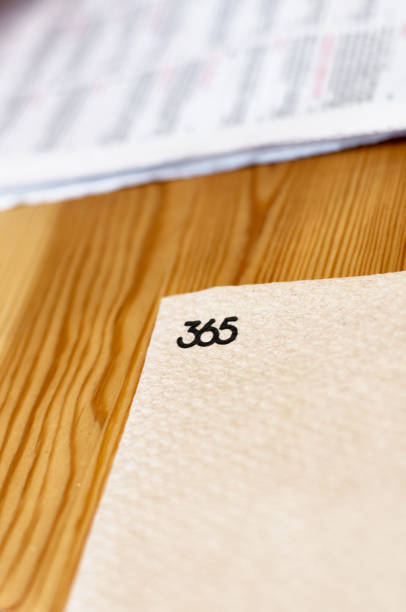 istock Wooden table with numbered paper 365 2183731727