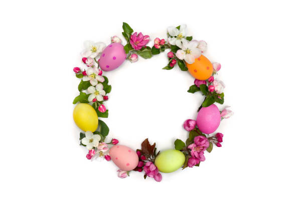 Decorated Wreath with Easter Eggs on wooden background