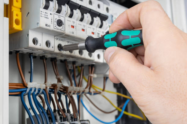 istock Hand Adjusting Circuit Breaker with Screwdriver 2183732691
