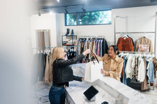 istock Boutique Small Business Owner Helps Client 2183734230