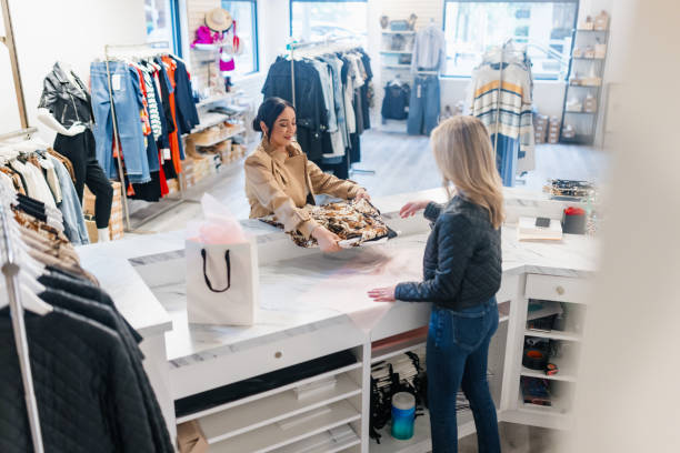 istock Boutique Small Business Owner Helps Client 2183734387