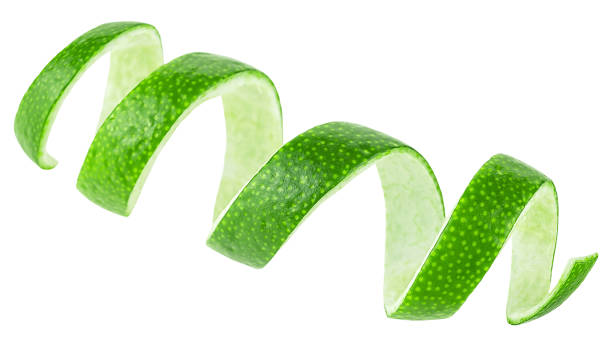 istock Fresh lime fruit peel isolated on a white background. Curly lime twist, selective focus. 2183734514