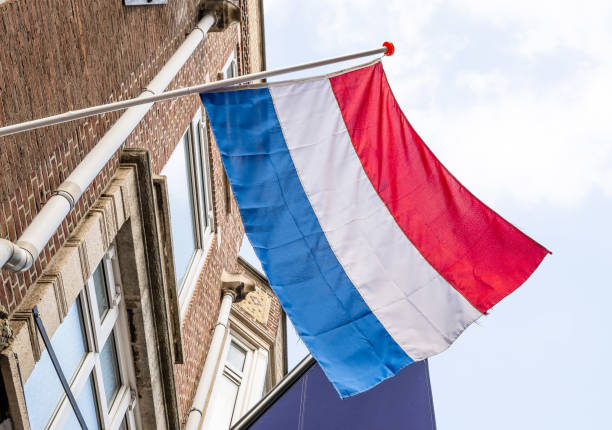 istock Flag in Amsterdam sky at netherlands street 2183735010