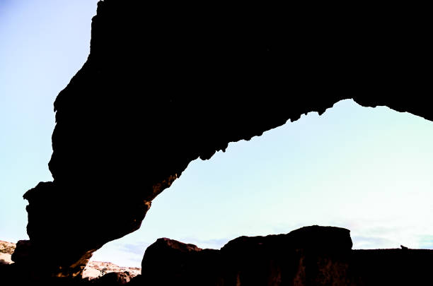 istock A large rock archway with a blue sky in the background 2183737454