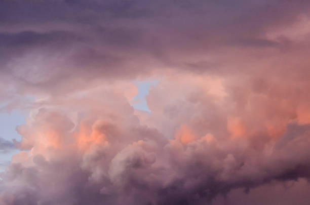 istock The sky is filled with clouds and the sun is setting 2183737484