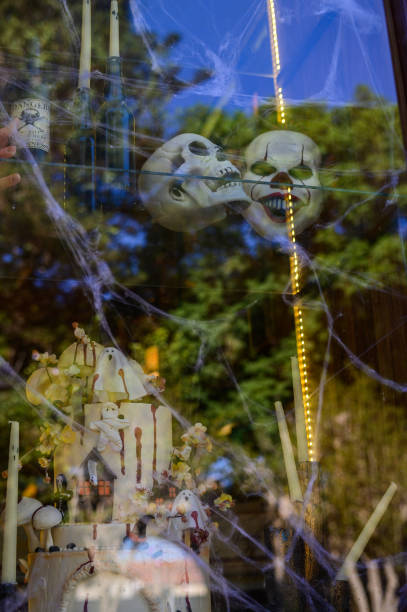 Eerie Halloween decorations with skulls and webbing in a festive autumn setting