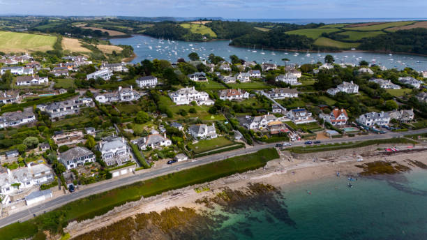 Drone shot taken over St Mawes, Cornwall, UK, focused on the headland and houses