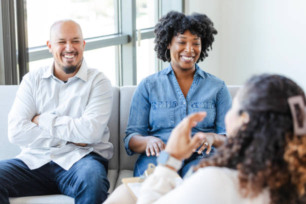istock Cheerful couple talk with female counselor 2183738586