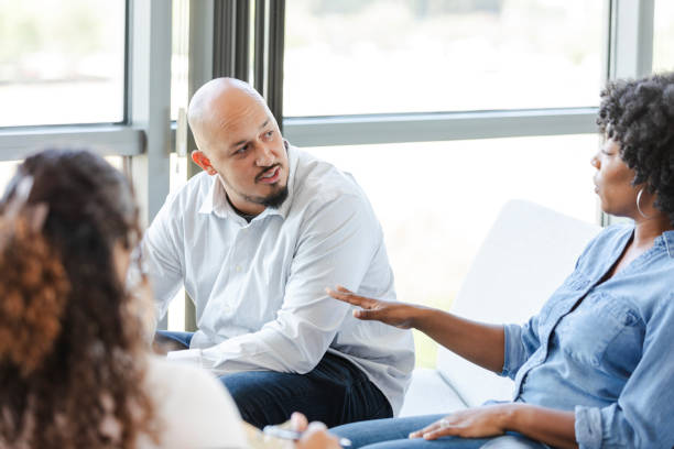istock Wife gestures while arguing with husband during counseling session 2183738591
