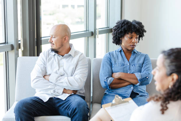istock Couple ignoring one another during counseling session 2183738595