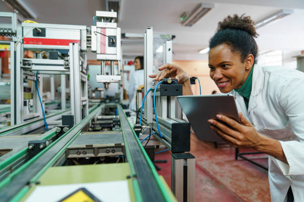 istock Mixed Race Female Scientist Optimizes Robotics in Classroom 2183739262