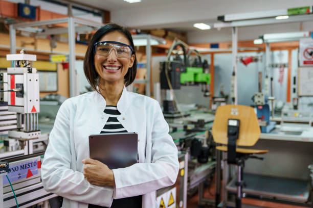 istock Smiling Female Robotic Engineer with Tablet in Classroom 2183739313