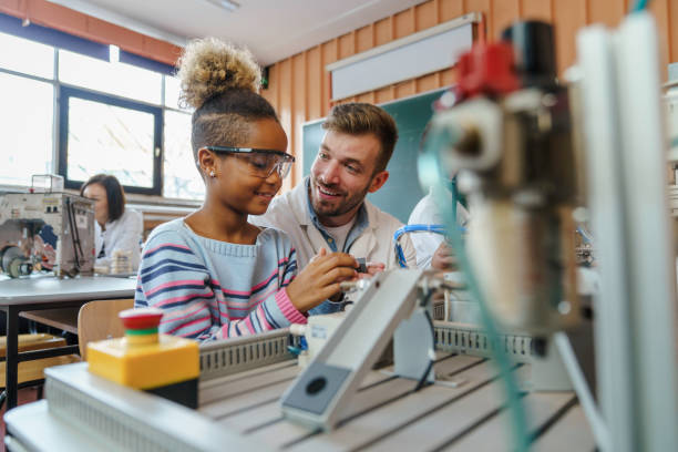 istock Engaged Girl Learning Robotics with Teacher 2183739364