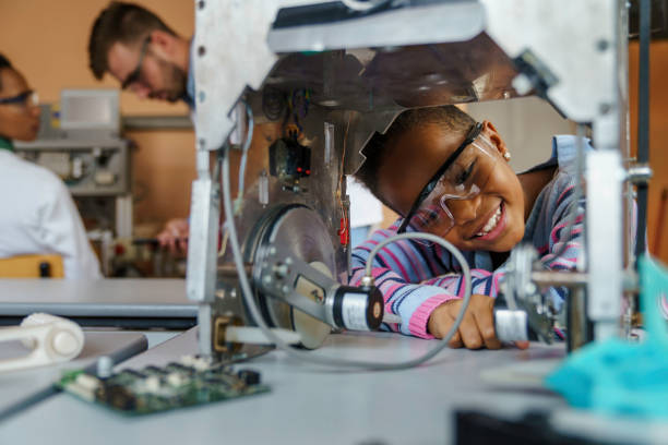 istock Enthusiastic Girl Engages in Robotics Workshop 2183739381