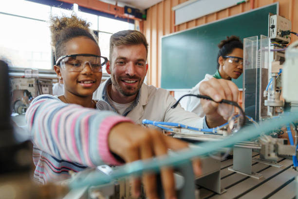 istock Engaged Girl Learns Robotics with Teacher in Lab 2183739395