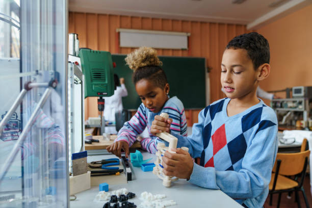 istock Diverse Children Engage in 3D Printing Workshop 2183739646