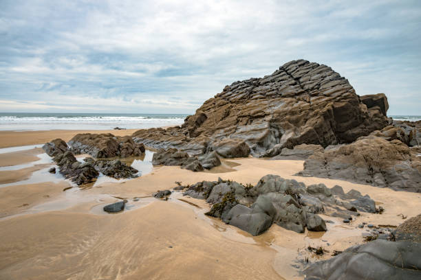 istock Rockpools in the sand at Sandymouth Cornwall 2183740406