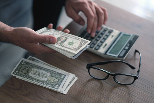 Man calculates budget at home