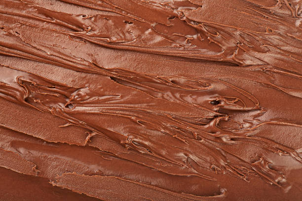 istock Melted chocolate cream as background, view from above. Hazelnut cream, chocolate smear. 2183743403