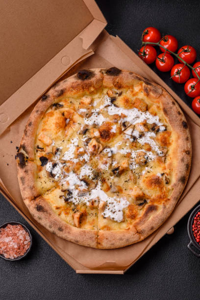 istock Creamy pizza with truffle cheese, mozzarella, chicken and mushrooms 2183744285