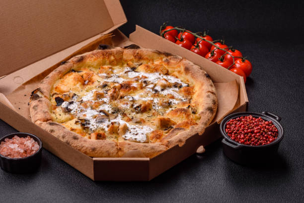 istock Creamy pizza with truffle cheese, mozzarella, chicken and mushrooms 2183744287
