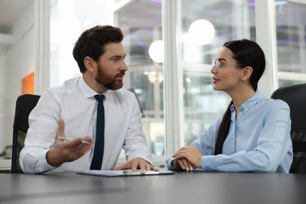 istock Lawyers with clipboard working together at table in office 2183752591