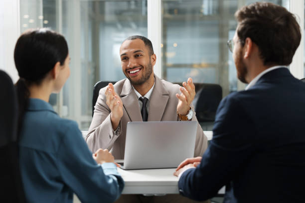 istock Lawyer working with clients at table in office 2183752620