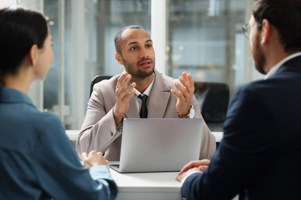 istock Lawyer working with clients at table in office 2183752827