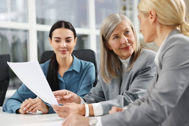 istock Lawyers working together at table in office 2183752831