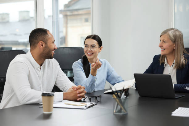 istock Lawyers working together at table in office 2183752835