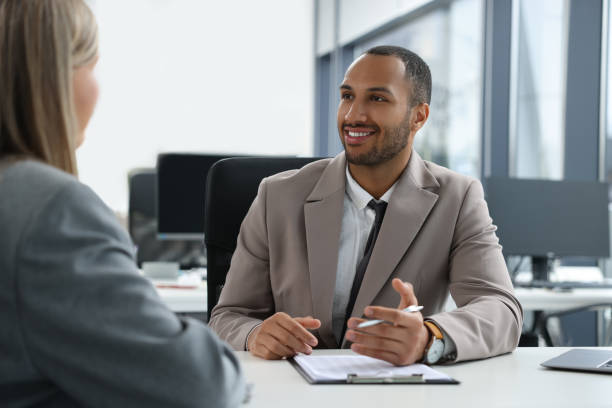 istock Lawyers working together at table in office 2183752860