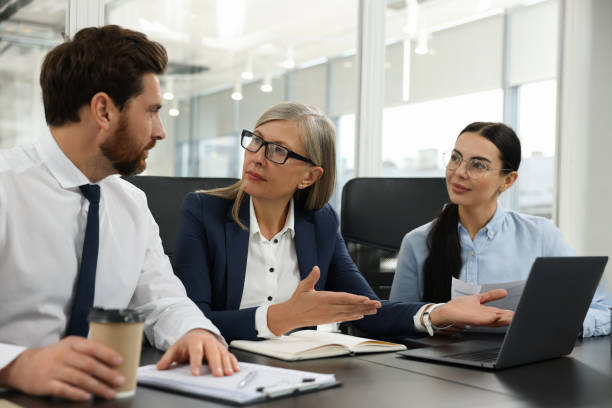 istock Lawyers working together at table in office 2183752865