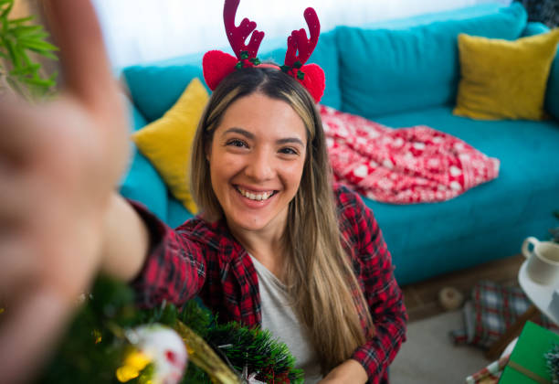 istock New Year's selfie next to the Christmas tree 2183758690