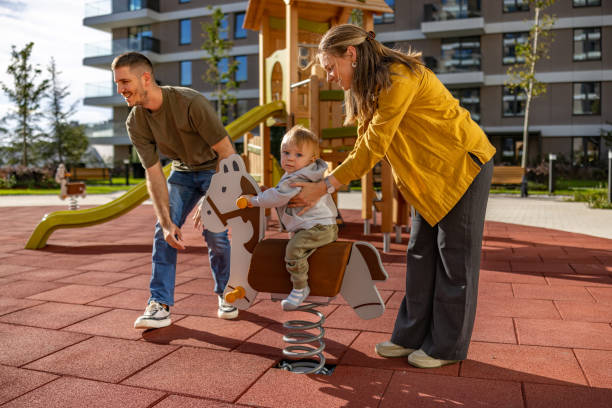 istock Parents having fun with their kid on the playground 2183758838