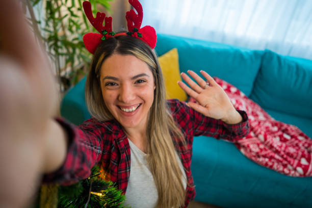 istock New Year's selfie next to the Christmas tree 2183758916