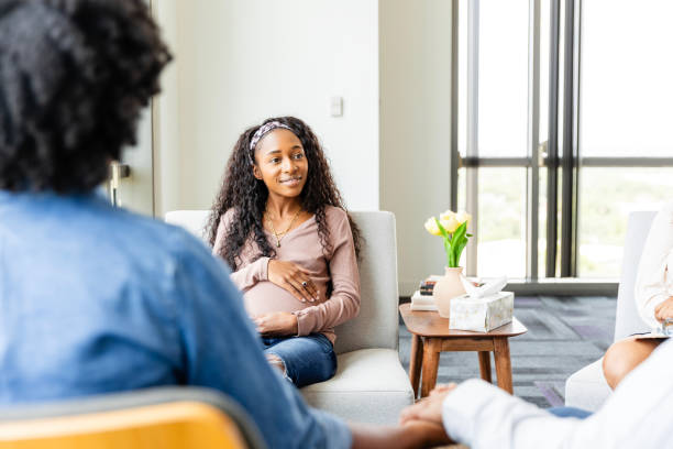 istock Birth mom talks with prospective adoptive parents during interview 2183759262