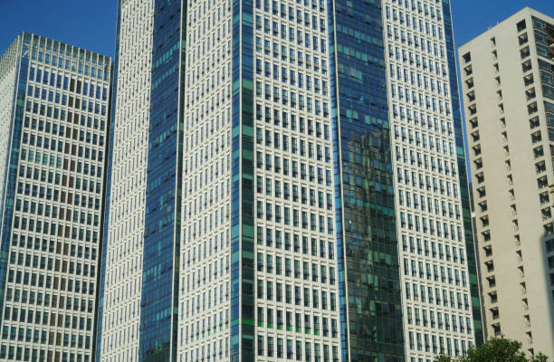 close up on modern office building skyscraper with blue glass wall