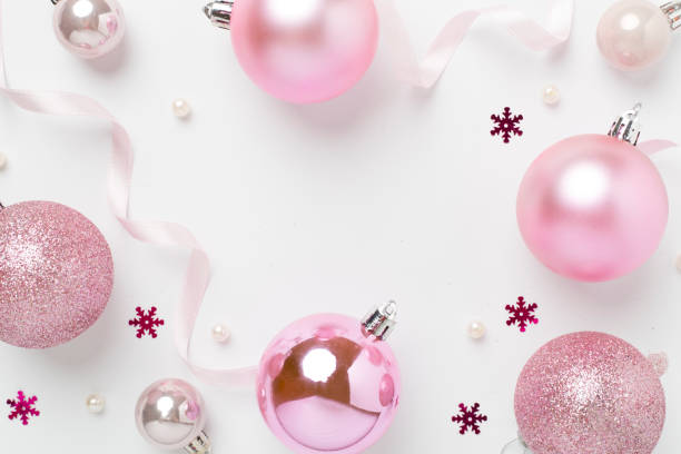 istock Pink christmas balls with decor on color background, top view 2183766906
