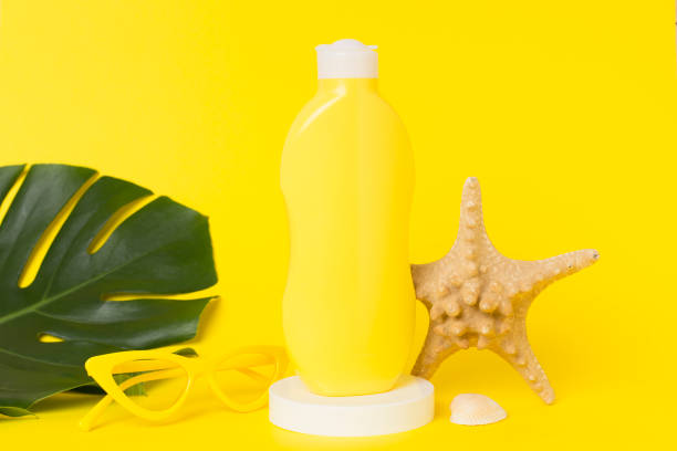 istock Sunscreen lotion with summer decor on table against color background 2183767580