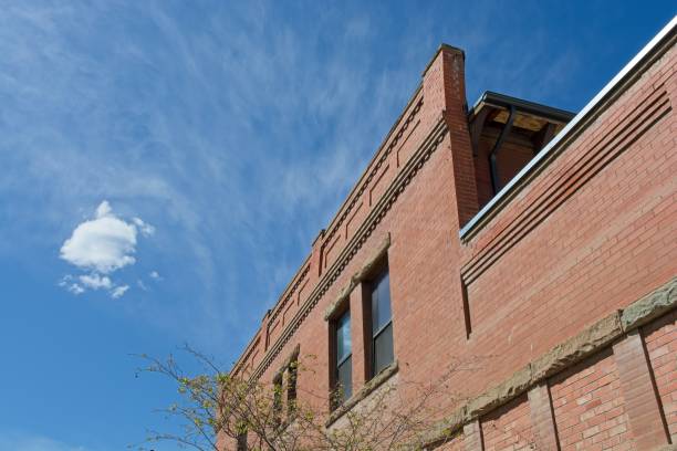 istock Brick parapet wall  beneath solitary cloud 2183768432