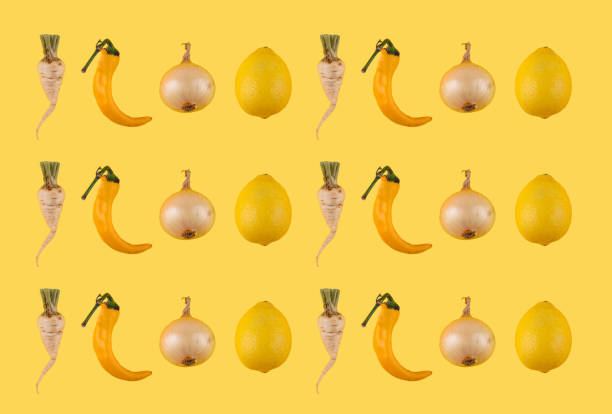 Assorted yellow fruits and vegetables against a bright yellow background.