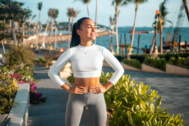 istock Active Hispanic Woman Doing Morning Exercises by the Sea 2183773644
