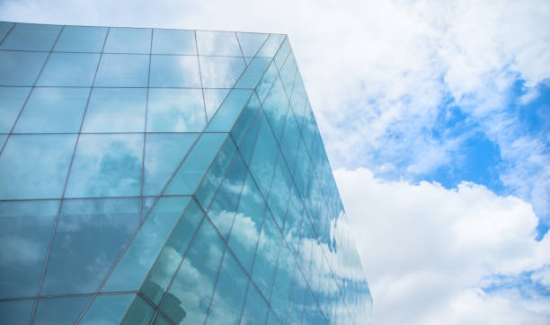 istock Modern Blue Glass Building Against cloudscape 2183774261